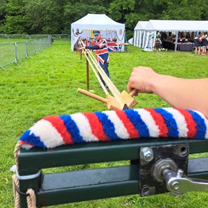 Maypole Rope Walk in action demonstrating bell rope manufacturing in a field at the British Country Show 2024.