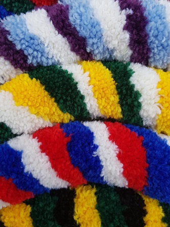 Collection of Maypole Bells mini-ring bells ropes showing a range of tri-coloured sallies.